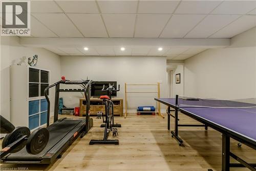 Workout room featuring a drop ceiling, wood finished floors, and recessed lighting - 5 Newport Lane, Port Dover, ON - Indoor