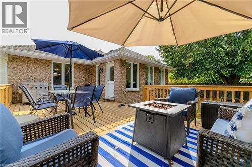 Deck with outdoor dining space, area for grilling, and an outdoor living space with a fire pit - 5 Newport Lane, Port Dover, ON - Outdoor With Deck Patio Veranda With Exterior