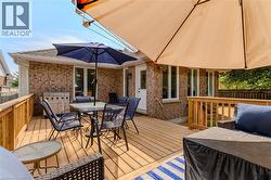 Deck featuring outdoor dining space and area for grilling - 