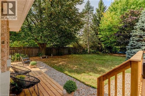 Fenced backyard featuring a wooden deck and a patio - 5 Newport Lane, Port Dover, ON - Outdoor With Deck Patio Veranda