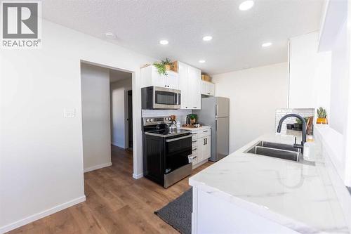 215 Overdown Drive, Red Deer, AB - Indoor Photo Showing Kitchen With Double Sink