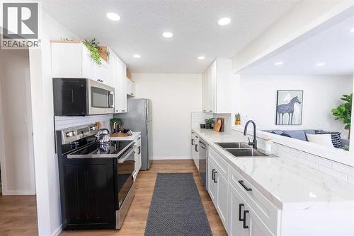 215 Overdown Drive, Red Deer, AB - Indoor Photo Showing Kitchen With Double Sink With Upgraded Kitchen