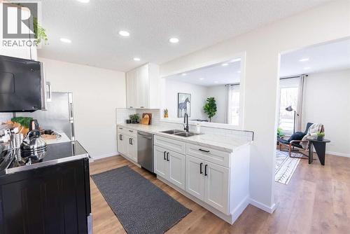 215 Overdown Drive, Red Deer, AB - Indoor Photo Showing Kitchen With Double Sink