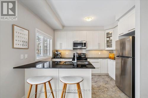 15 - 2220 Queensway Drive, Burlington, ON - Indoor Photo Showing Kitchen With Stainless Steel Kitchen With Double Sink With Upgraded Kitchen