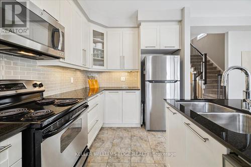 15 - 2220 Queensway Drive, Burlington, ON - Indoor Photo Showing Kitchen With Stainless Steel Kitchen With Double Sink With Upgraded Kitchen