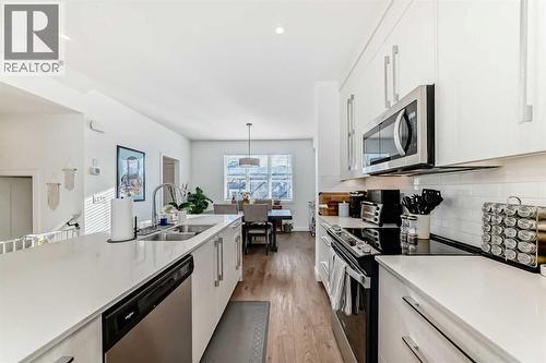 197 Dawson Way, Chestermere, AB - Indoor Photo Showing Kitchen With Double Sink With Upgraded Kitchen