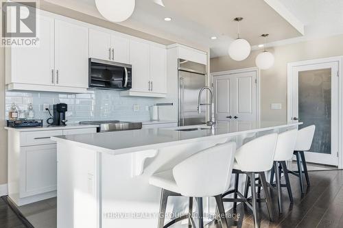 205 - 240 Villagewalk Boulevard, London North (North R), ON - Indoor Photo Showing Kitchen With Upgraded Kitchen