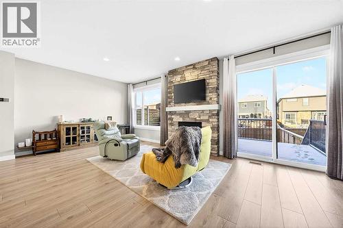 13 Cranbrook Close Se, Calgary, AB - Indoor Photo Showing Living Room With Fireplace