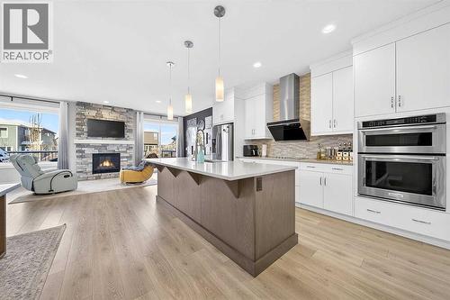 13 Cranbrook Close Se, Calgary, AB - Indoor Photo Showing Kitchen With Fireplace With Upgraded Kitchen