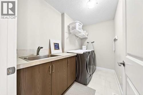 13 Cranbrook Close Se, Calgary, AB - Indoor Photo Showing Laundry Room