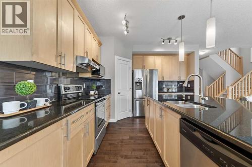 93 Silverado Bank Circle Sw, Calgary, AB - Indoor Photo Showing Kitchen With Double Sink With Upgraded Kitchen