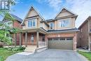 61 Mcisaac Drive, Springwater, ON  - Outdoor With Facade 