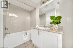 Bathroom with bathtub / shower combination and vanity - 