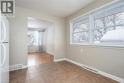 Spare room with plenty of natural light and light tile patterned floors - 