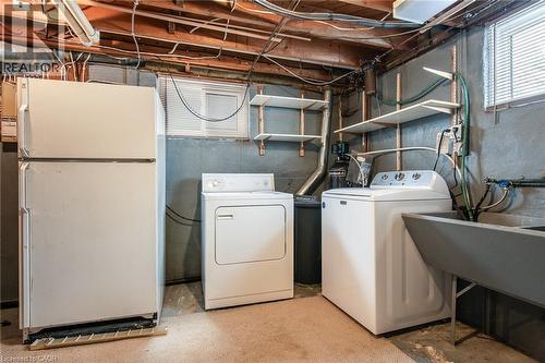 Washroom featuring washer and dryer and unfinished concrete floors - 120 Fourth Avenue, Kitchener, ON - Indoor Photo Showing Laundry Room