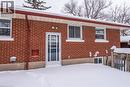 Snow covered property entrance with brick siding - 120 Fourth Avenue, Kitchener, ON  - Outdoor With Exterior 