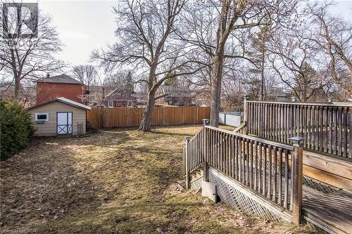 Fenced backyard with a wooden deck and a shed - 120 Fourth Avenue, Kitchener, ON - Outdoor