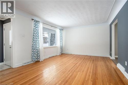 Empty room with baseboards and light wood-style floors - 120 Fourth Avenue, Kitchener, ON - Indoor Photo Showing Other Room