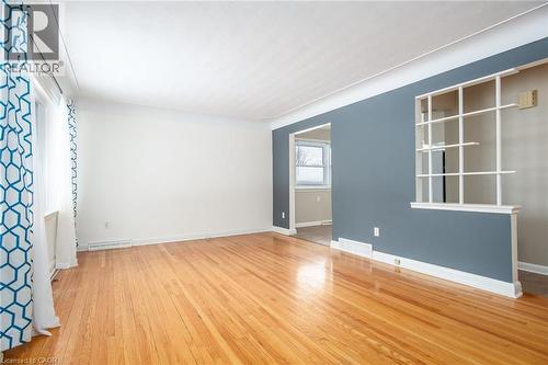 Empty room featuring light wood-type flooring and baseboards - 120 Fourth Avenue, Kitchener, ON - Indoor Photo Showing Other Room