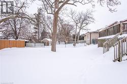View of yard covered in snow - 