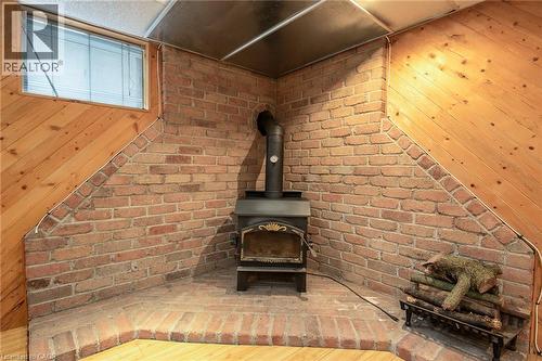 Detailed view of wood walls and a wood stove - 120 Fourth Avenue, Kitchener, ON - Indoor Photo Showing Other Room