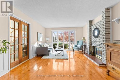 22 Banting Crescent, Ottawa, ON - Indoor Photo Showing Living Room With Fireplace