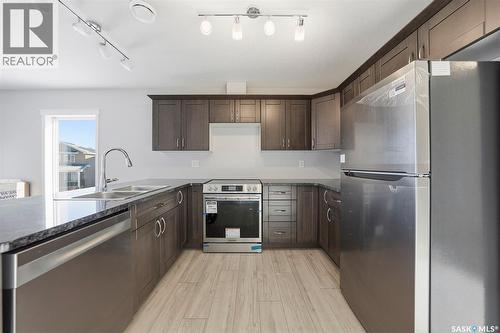 512 103 Klassen Crescent, Saskatoon, SK - Indoor Photo Showing Kitchen With Double Sink