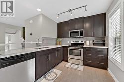 Ceiling-height cabinets and stainless steel appliances - 