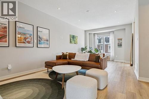 Living area featuring light wood-style floors and recessed lighting - 2220 Queensway Drive Unit# 15, Burlington, ON - Indoor Photo Showing Living Room