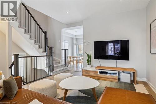 Living room featuring stairs and wood finished floors - 2220 Queensway Drive Unit# 15, Burlington, ON - Indoor Photo Showing Living Room
