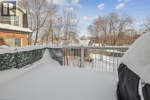 View of snow covered deck - 2220 Queensway Drive Unit# 15, Burlington, ON - Outdoor