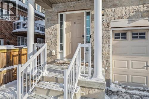 Entrance to property featuring stone siding - 2220 Queensway Drive Unit# 15, Burlington, ON - Outdoor With Balcony