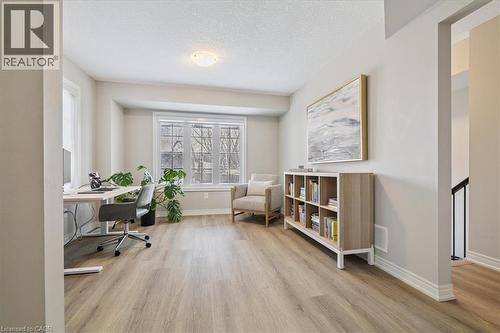 Office space featuring light wood-style floors and a textured ceiling - 2220 Queensway Drive Unit# 15, Burlington, ON - Indoor