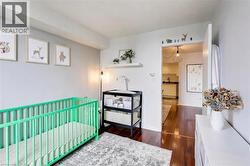 Bedroom with dark wood-style flooring and a sink - 