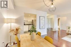 Dining space with light wood finished floors and baseboards - 