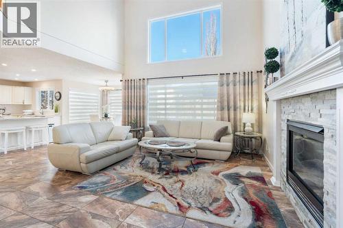 25 Cranwell Place Se, Calgary, AB - Indoor Photo Showing Living Room With Fireplace