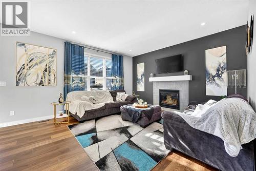 37 Evansfield Manor Nw, Calgary, AB - Indoor Photo Showing Living Room With Fireplace