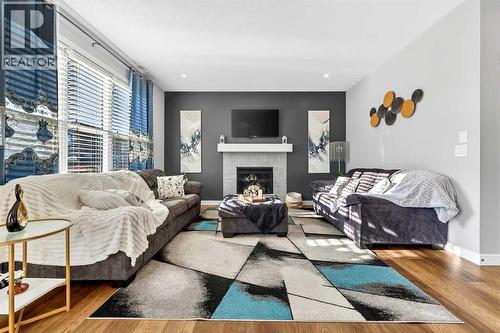 37 Evansfield Manor Nw, Calgary, AB - Indoor Photo Showing Living Room With Fireplace