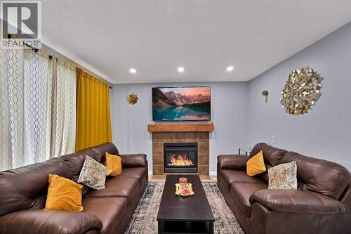 67 Copperstone Circle Se, Calgary, AB - Indoor Photo Showing Living Room With Fireplace