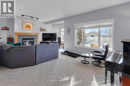 53 Scimitar Heath Nw, Calgary, AB - Indoor Photo Showing Living Room With Fireplace