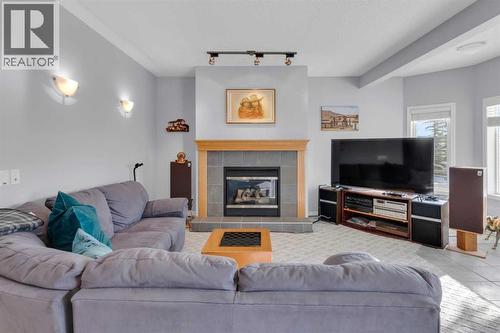 53 Scimitar Heath Nw, Calgary, AB - Indoor Photo Showing Living Room With Fireplace