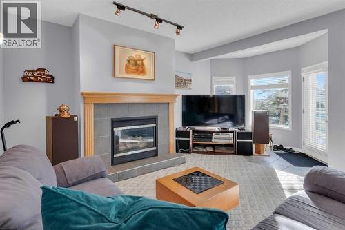 53 Scimitar Heath Nw, Calgary, AB - Indoor Photo Showing Living Room With Fireplace