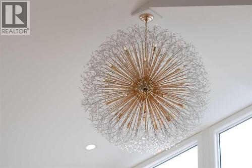 Chandelier - 58 Edgevalley Close Nw, Calgary, AB - Indoor Photo Showing Other Room