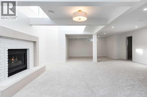 Family/Recreation Room - Basement - 58 Edgevalley Close Nw, Calgary, AB - Indoor With Fireplace