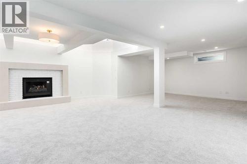 Family/Recreation Room - Basement - 58 Edgevalley Close Nw, Calgary, AB - Indoor With Fireplace