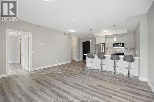 728 Brownstone Drive Unit# 201, Tecumseh, ON - Indoor Photo Showing Kitchen With Upgraded Kitchen