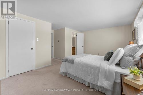 Cheater door to bathroom on right - closet on left - 402 Sandhamn Private, Ottawa, ON - Indoor Photo Showing Bedroom