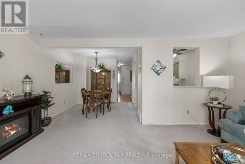 View from the patio door - 402 Sandhamn Private, Ottawa, ON - Indoor Photo Showing Other Room With Fireplace