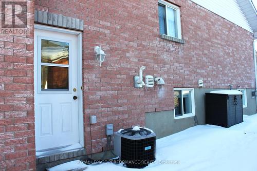 Side entrance behind garage - 1791 Cumberland Street, Cornwall, ON - Outdoor With Exterior