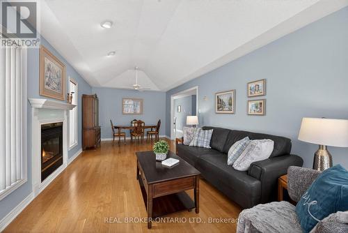 Large room hardwood floors - 9 Riverdale Drive, Wasaga Beach, ON - Indoor Photo Showing Living Room With Fireplace